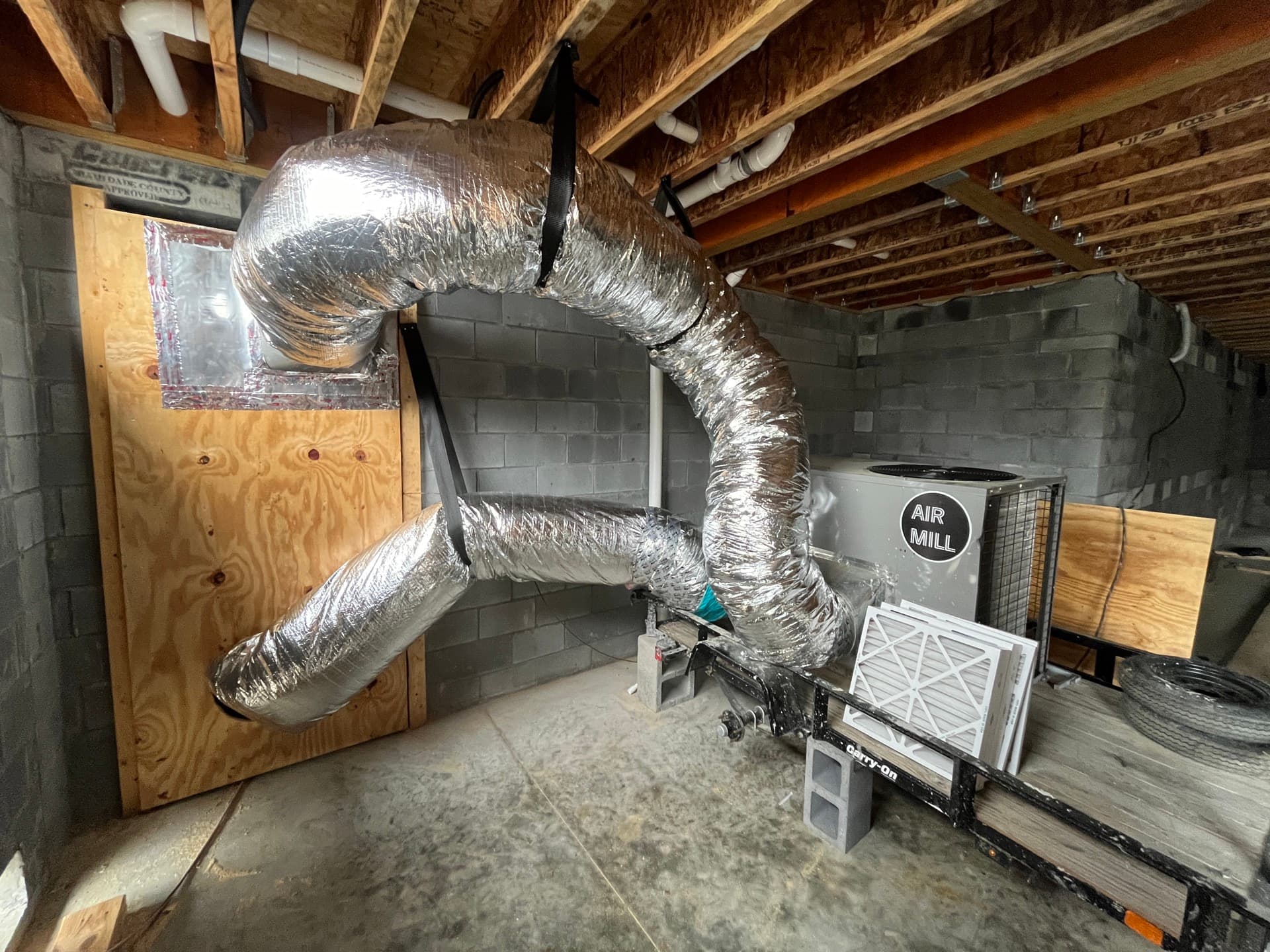 AirMill HVAC unit with insulated ductwork installed in a construction site